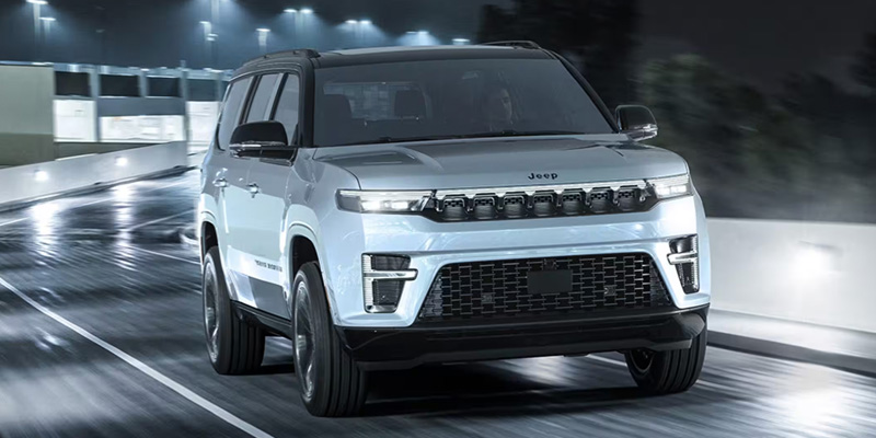 New 2026 Jeep Grand Wagoneer Cruising on Road in it's front profile